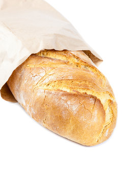 Bread in a paper bag on white background.
