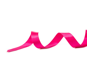 Holiday pink ribbon on white background.
