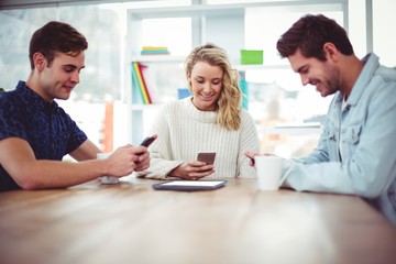 Fototapeta premium Creative team all using smartphones