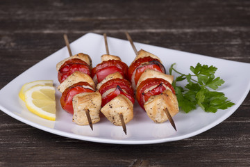 Tasty grilled meat and vegetables on skewer . Close up