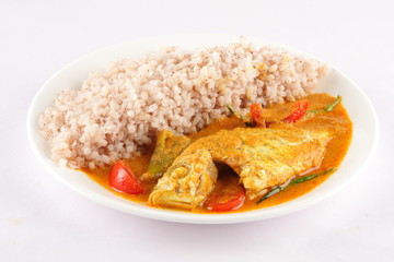 Red rice with Fish masala Indian cuisine.