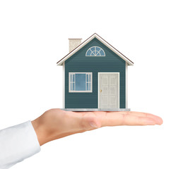 holding house representing home ownership