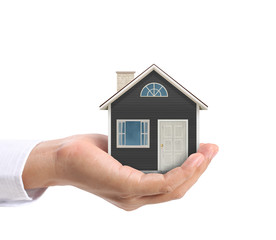holding house representing home ownership