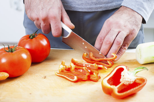 Preparing fresh organic food. Cutting vegetables