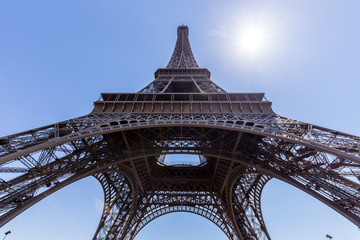 Lower view of Eiffel Tower in Paris, France.