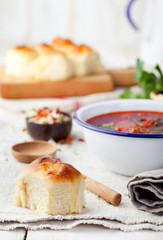 Traditional Ukrainian Russian vegetable soup, borsch with garlic donuts, pampushki.