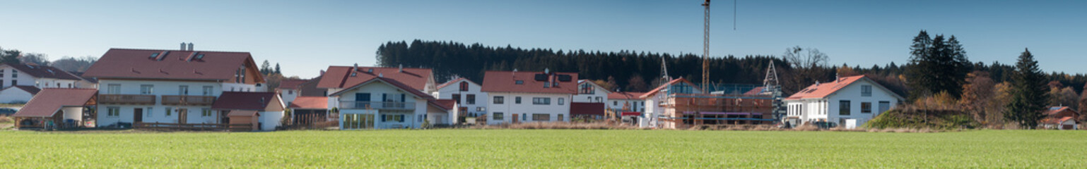 Fototapeta na wymiar panorama of family houses and building site