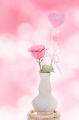 Love concept, roses and pink heart with love word