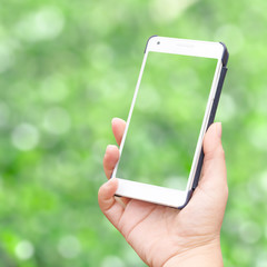 Hand holding mobile smart phone isolated