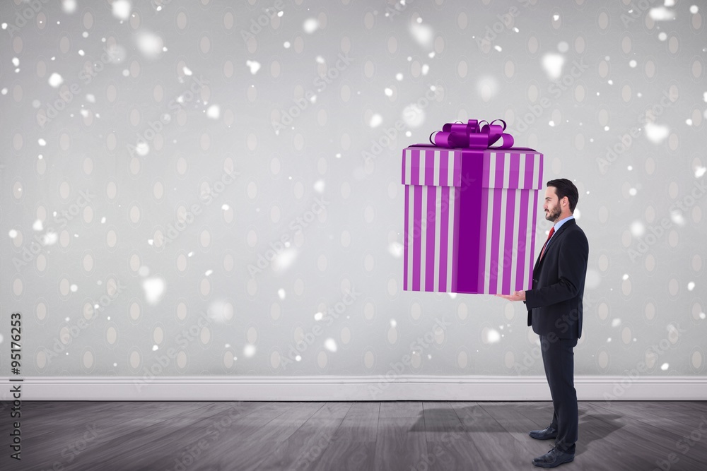 Poster Composite image of stylish man with giant gift