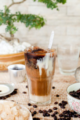 Traditional Vietnamese, Thai Ice coffee with beans on wooden background