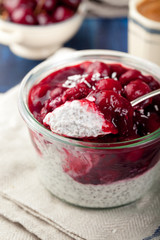 Chia seed pudding, dessert with cherries and granola. 
