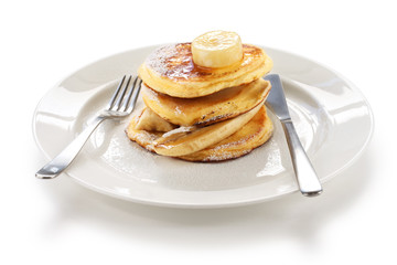 fluffy ricotta pancakes with banana isolated on white background
