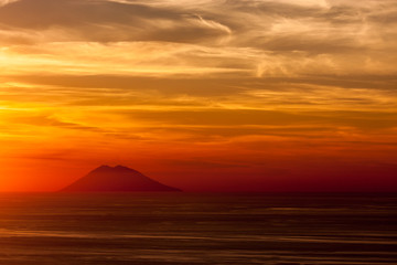 Naklejka na ściany i meble Stromboli volcano at sunset