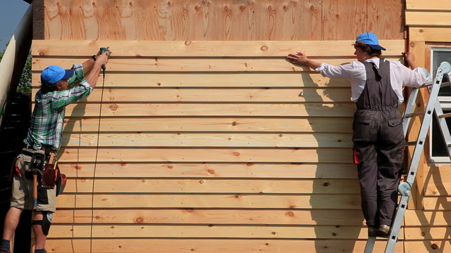 The Wall is Almost Ready/Carpenter fixing Wood Siding on the House. Timelapes