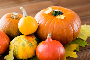 close up of pumpkins on wooden table at home