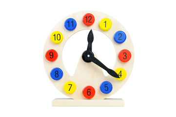 Wooden clock on a white background. Toy for Children