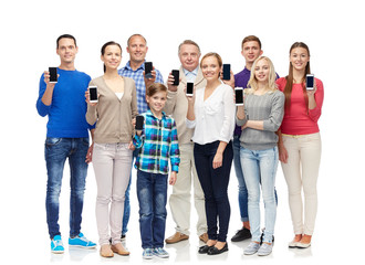 Fototapeta premium group of smiling people with smartphones