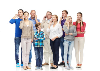 Fototapeta premium group of smiling people with smartphones