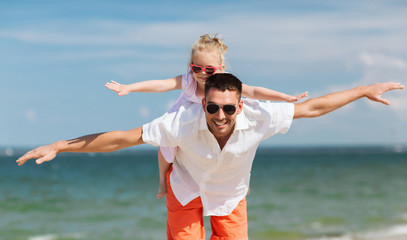 happy family having fun on summer beach