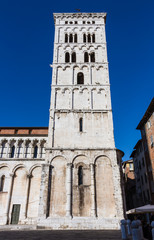 Fototapeta na wymiar Bell tower of San Michele in Foro Church in Lucca, Tuscany, Italy