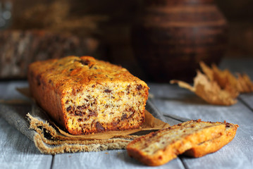 cut pumpkin cake with chocolate on the gray boards