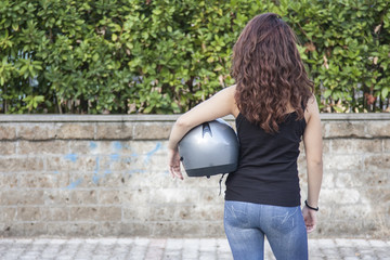 woman biker and her helmet