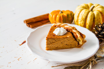 Pumpkin pie, white wood background