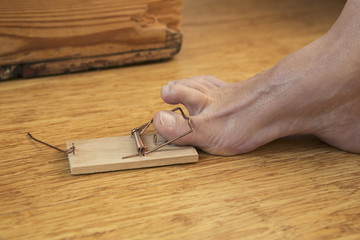 toe caught in mousetrap