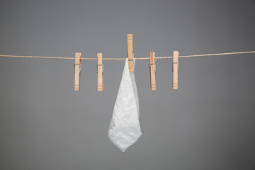 wet handkerchief hanging on rope  - obrazy, fototapety, plakaty