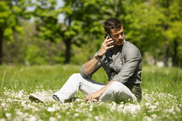 Handsome Man Talking On Mobile Phone Outdoor