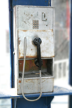 Old worn publin phone in phone box