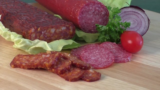 Sausage of salami on a cutting board 
