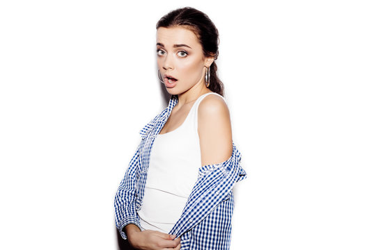 Surprised Girl In Blue Plaid Shirt On White Background