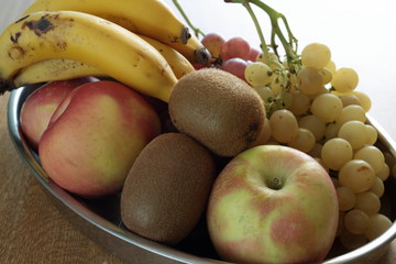 tray full of assorted fruits on a wooden table