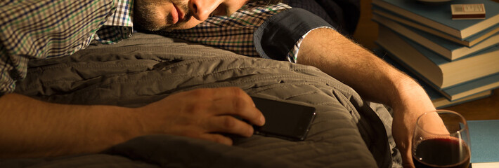 Bored male lying in bed
