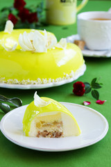 Pineapple mousse cake covered with a mirror coating.