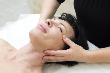 Fototapeta na wymiar Woman in a beauty salon doing massage