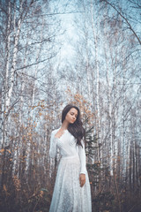Beautiful lady in a birch forest