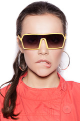 Young sexy woman in sunglasses on white background