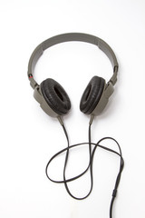 Black pair of vintage headphones on a White Background