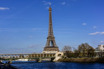 Fototapeta na wymiar River Seine Embankment with Eiffel Tower (La Tour Eiffel). Paris