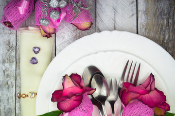 Holiday romantic table setting with pink roses on a white background
