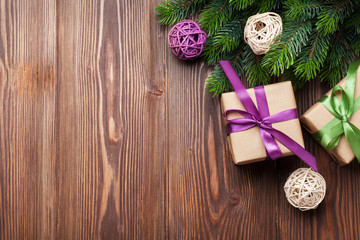 Fototapeta premium Christmas gift boxes and fir tree on table