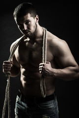 Fototapeta na wymiar Muscular man with rope