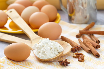 Fototapeta na wymiar Dough preparation. Baking ingredients: eggs, flour and spices.
