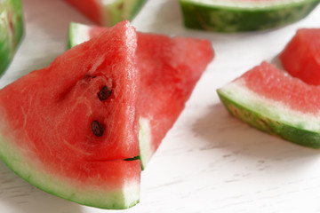 Sliced watermelon on wooden table closeup