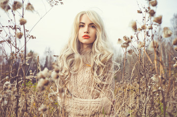 Beautiful lady in autumn landscape