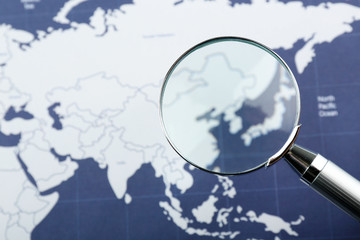 World map with magnifying glass. Worldly cuisine concept