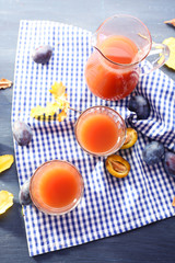 Plum Juice in a glasses with fresh fruits